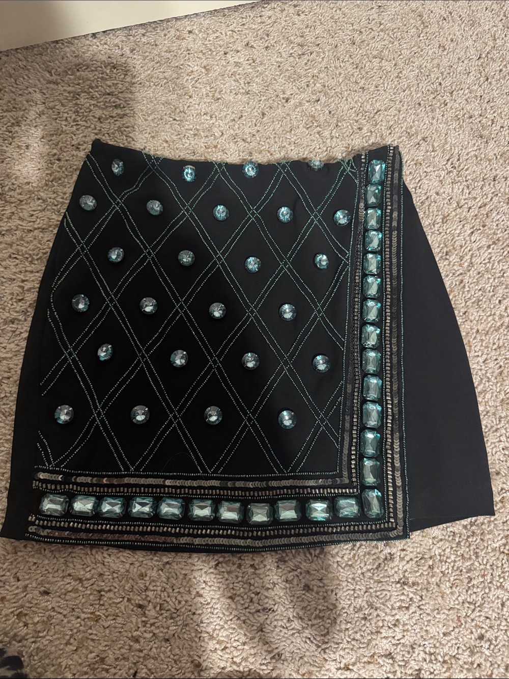 bebe Black Mini Skirt with Teal Crystal Embellishment